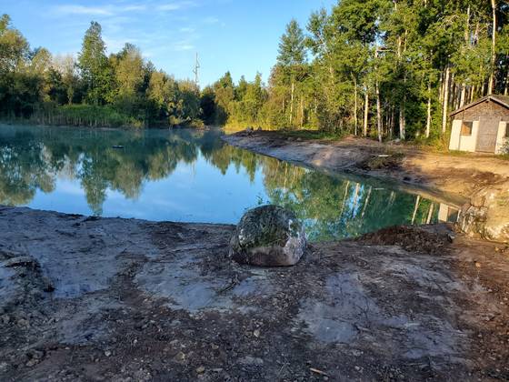 Finished pond with rock edge and boulder