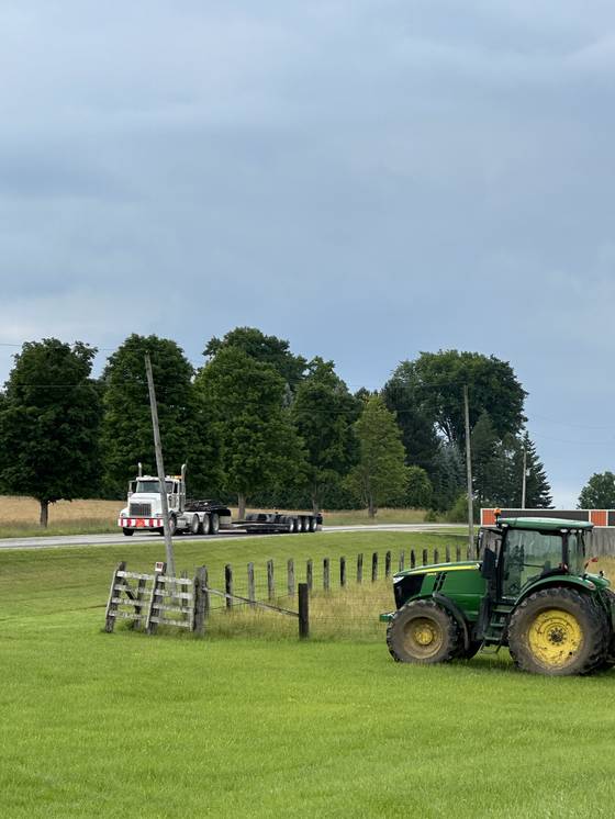 Tractor in a fenced farm field