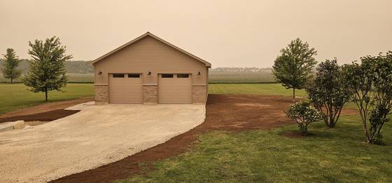 New garage with concrete driveway