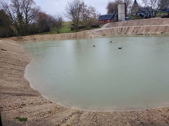 Large pond with sloped banks