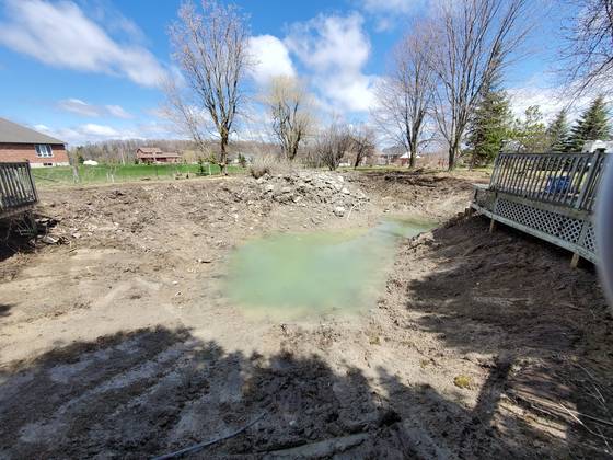 Pond excavation with muddy water